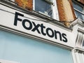 Foxtons estate agent shop sign. London, UK.