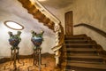 The foyer in the Casa Batllo with ceramic vases and wooden stairs, the architect Antonio Gaudi. Barcelona, Catalonia