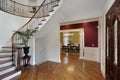 Foyer in luxury home with curved staircase