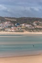 View of a professional sports practicing extreme sports Kiteboarding at the Obidos lagoon