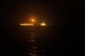 FPSO tanker vessel near Oil Rig at night. Offshore oil and gas industry Royalty Free Stock Photo