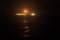 FPSO tanker vessel near Oil Rig at night. Offshore oil and gas industry Royalty Free Stock Photo