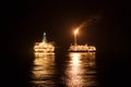 FPSO tanker vessel near Oil Rig at night. Offshore oil and gas industry Royalty Free Stock Photo