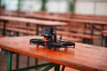 FPV Cinewhoop drone on a table with a GoPro on top