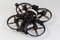 FPV drone with on-board camera on a gray background Royalty Free Stock Photo