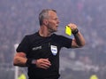 Dutch FIFA referee Bjorn Kuipers shows a yellow card