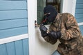 Fractional man breaking into a residential building in Finland.