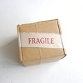 Fragile cardboard box isolated on white background