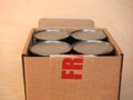 Fragile cardboard box with tin cans Royalty Free Stock Photo