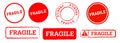 fragile square and circle red rubber stamp sticker logo sign package breakable storage Royalty Free Stock Photo