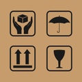 Fragile symbol on cardboard. Set of fragile icons on cardboard. Umbrella,glass, arrow and hands box signs Royalty Free Stock Photo