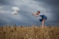 Fragile Woman Keeps Balloons Against Strong Wind Royalty Free Stock Photo