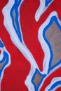 Fragment of an abstract background of red and blue graffiti on a concrete wall