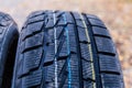 Fragment of the aggressive tread of car tire selective focus