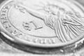 Fragment of an American 1 one dollar coin close-up. Black and white background or wallpaper on the theme of the USA economy, Royalty Free Stock Photo