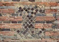 Fragment of the ancient masonry in the modern brickwall Royalty Free Stock Photo