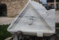 Fragment of ancient temple with Medusa head image