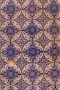 Fragment of an ancient wall lined with blue azulejo tiles background
