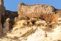 Fragment of ancient yellow stone wall and basement. The photo was taken in ruined Villa di Nerone, Anzio