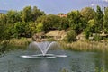 Fragment of artificial pond and fountain with beauty drops