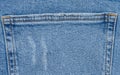 Fragment of the back pocket of blue jeans Royalty Free Stock Photo