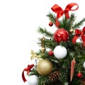 Fragment of a beautiful christmas tree with colorful decorations, cones, balls and ribbons, isolated on white
