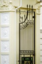 A fragment of a beautiful wrought-iron gate. Vertical photography Royalty Free Stock Photo