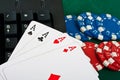 Fragment of black keyboard with chips and cards.