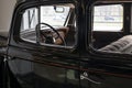 A fragment of the black lacquer body of the famous Soviet retro passenger car of the Gorky Automobile Plant