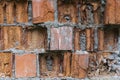 Fragment of a brick wall collapsing from external factors
