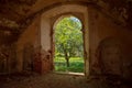 A fragment of a brick wall with a doorway.