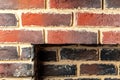 Fragment of a brick wall fireplace with a rectangular niche Royalty Free Stock Photo