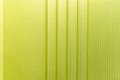 A fragment of a bright lime-colored wall with moldings. Modern trends in interior design and decoration. Space for text Royalty Free Stock Photo