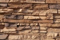 Fragment of brown flat stone wall Royalty Free Stock Photo