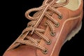 Fragment of brown mens shoe with shoelaces on dark background Royalty Free Stock Photo
