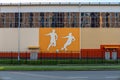 Fragment of the building of the sports complex. Images of silhouettes of anyone