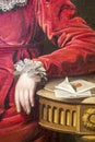 Fragment of the canvas `Portrait of Countess P. P. Kutaisova`, artist Jan Rombauer. Woman`s hand in a red dress. Female hand