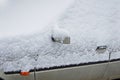 Fragment of the car body covered with wet snow Royalty Free Stock Photo