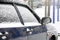 Fragment of the car under a layer of snow after a heavy snowfall Royalty Free Stock Photo