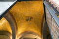 Fragment of a ceiling covered with golden mosaic and Byzantine eagle in Naples, Italy