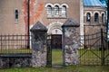 open metal gate and walkway leading to the entrance to the church, selective focus Royalty Free Stock Photo