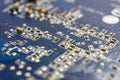 Fragment of the circuit board of the graphics card with installed electronic components