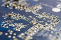 Fragment of the circuit board of the graphics card with installed electronic components Royalty Free Stock Photo