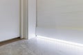 Fragment of classic interior with french herringbone parquet floor and skirting boards. The final stage of finishing works in the Royalty Free Stock Photo