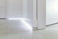 Fragment of classic interior with french herringbone parquet floor and skirting boards. The final stage of finishing works in the Royalty Free Stock Photo