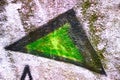 A fragment of colored graffiti painted on a concrete wall. Bright abstract background for design with a triangle. Copy Royalty Free Stock Photo