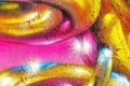 A fragment of colorful graffiti painted on a wall. Abstract urban background Royalty Free Stock Photo