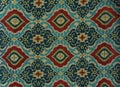 Fragment of colorful retro tapestry textile pattern with floral ornament useful as background Royalty Free Stock Photo