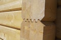 Fragment of a construction built of glued pine timber beams. Royalty Free Stock Photo