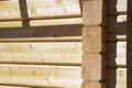 Fragment of a construction built of glued pine timber beams. Royalty Free Stock Photo